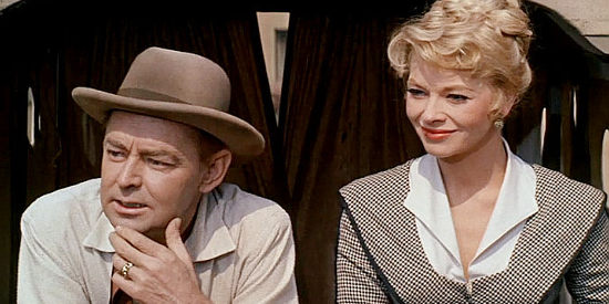 Alan Ladd as Mitch, returning to town with his new wife Julie (Dolores Michaels) in One Foot in Hell (1960)