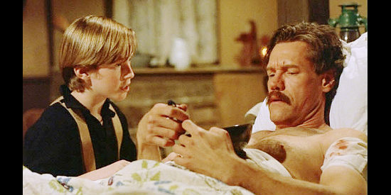 Alec Medlock as Daniel Fowler with Jack Cole (Randy Travis), the gunman who shows up at the Fowler ranch in The Long Ride Home (2003)