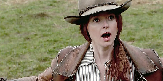 Allison Hossack as Liz Calhoun, stepping into the middle of a dispute between Shea McCall and BJ Stokers in The Gambler, the Girl and the Gunslinger (2009)