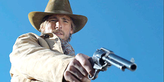 Andrew W. Walker as Cole Brandt, dispensing justice with his six-gun in The Gundown (2011)