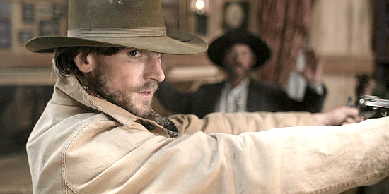 Andrew W. Walker as Cole Brandt, ready to even the odds in The Gundown (2011)