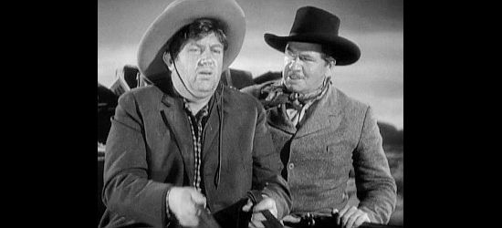 Andy Devine as Buck and George Bancroft as Marshal Curley Wilcox, on a stage bound for Lordsburg in Stagecoach (1939)