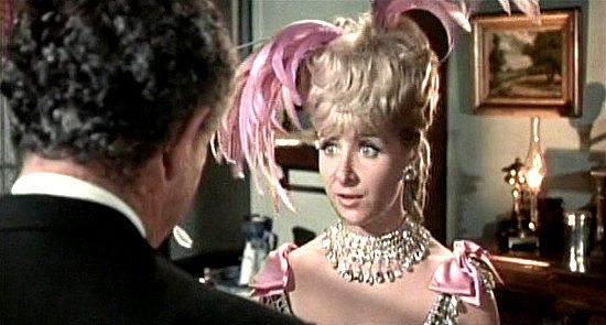 Angela Douglas as Annie Oakley, flirting with The Rump Kid to learn what she wants to know in Carry On Cowboy (1966)