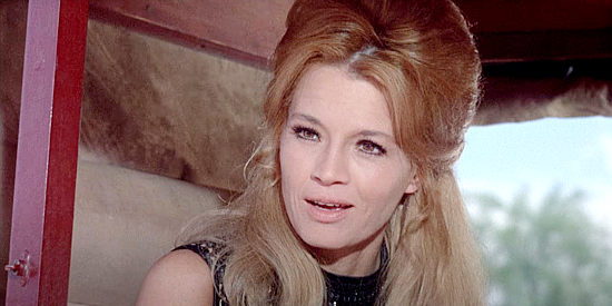 Angie Dickinson as Lily Beloit, convinced her tawdry past will scare off any man in Young Billy Young (1969)
