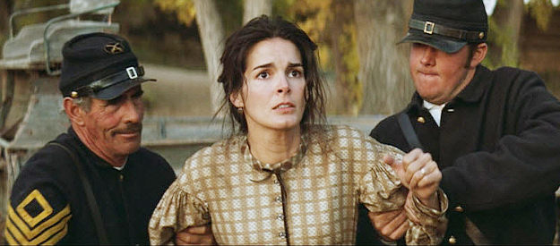 Angie Harman as Rose, Carver's wife, watching as Union troops torch her home in Seraphim Falls (2006)