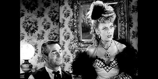 Ann Dvorak as Rita, the dance hall queen quarreling with Dan Mitchell again in Abilene Town (1946)