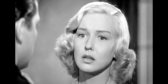 Ann Savage as Jean Shelby, the young woman determined to avenge her brother's death in Renegade Girl (1946)