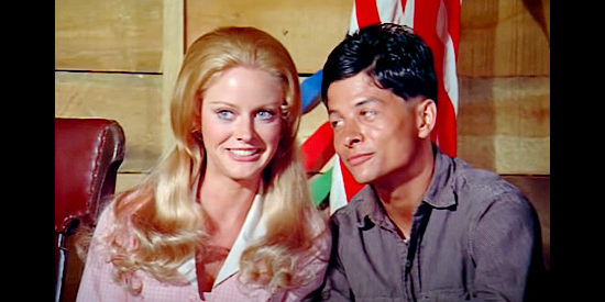 Anne Randall as Nellie Winters and Richard Lapp as Cass Dunning, enjoying their wedding party in A Time for Dying (1969)