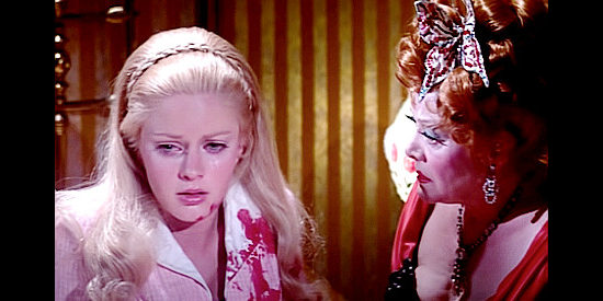 Anne Randall as Nellie Winters, finding herself under the care of whorehouse madam Mamie (Beatrice Kay) in A Time for Dying (1969)