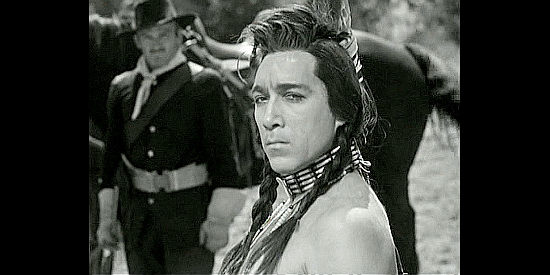 Anthony Quinn as Crazy Horse, meeting George Custer for the first time in They Died with Their Boots On (1941)