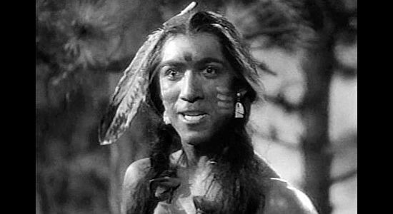 Anthony Quinn as a Sioux warrior, gleefully sharing news of Custer's demise in The Plainsman (1936)