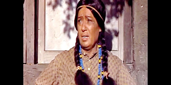 Argentina Brunetti as Sarita, Ross Sawyer's Indian wife, watching Sheriff Horne show up looking for the Sawyer boys in Stage to Thunder Rock (1964)
