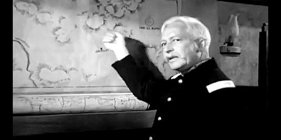 Art Baker as Col. James Reid, pointing out the predicament facing his cavalry in Massacre River (1949)