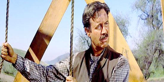 Arthur O'Connell as Tom Wyatt, drilling for oil at Yancey Cravet's advice in Cimarron (1960)