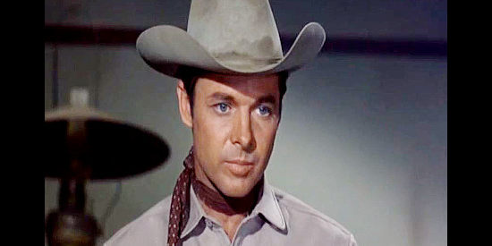 Audie Murphy as Banner Cole, realizing he'll have to get justice for longtime friend Webb in Posse from Hell (1961)