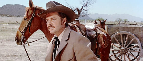 Audie Murphy as Cash Zachary, smelling something suspicious upon his return home in The Unforgiven (1960)