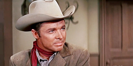 Audie Murphy as Clay Santell, wondering about the cool reception he's receiving in Hell Bent for Leather (1960)