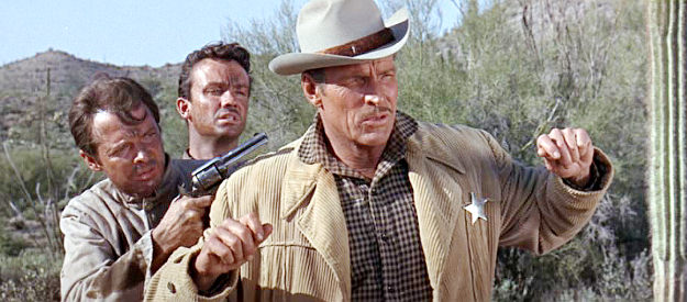 Audie Murphy as Clint and Ben Cooper as Willie Martin, staging an escape from Capt. Andrews (Buster Crabbe) in Arizona Raiders (1965)