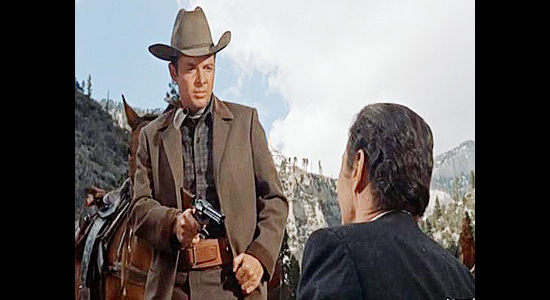 Audie Murphy as Seven with Jim Flood (Barry Sullivan) under his gun in Seven Ways from Sundown (1960)