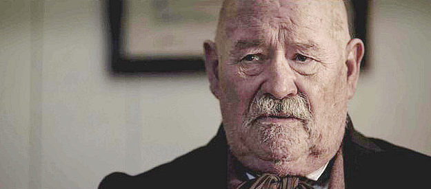 Barry Corbin as Judge Smith, the man who sentences Jean Baptiste in Redemption for Robbing the Dead (2011)