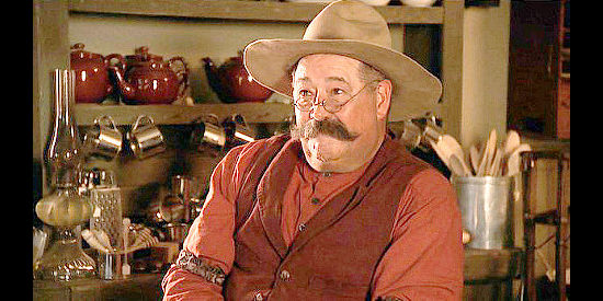 Barry Corbin as storekeeper Bob Alderson in Monte Walsh (2003)