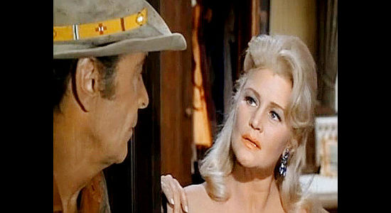 Barry Sullivan as Chaddock looking up teacher turned saloon girl Nora Johnson (Joan Caulfield) in Buckskin (1968)