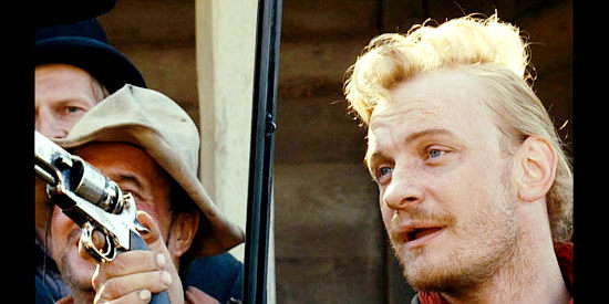 Bartosz Zukowski as The Blonde Man, part of the posse in Dead Man's Bounty (2006)