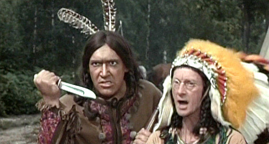 Bernard Bresslaw as Little Heap and Charles Hawtrey as Chief Big Heap, negotiating with The Rumpo Kid in Carry On Cowboy (1966)