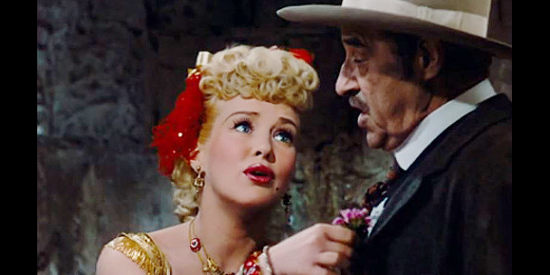 Betty Grable as Freddie jones, flirting to get her way with Sheriff Ambrose (Al Bridge) in The Beautiful Blonde from Bashful Bend (1949)