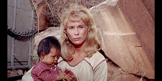 Bibi Andersson as Ellen Grange, holding her half-breed son, the reason she kept trying to return to the Apaches in Duel at Diablo (1966)