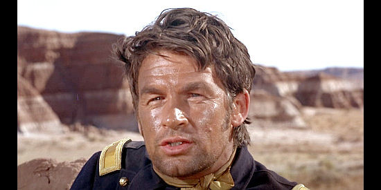 Bill Travers as Lt. Scott McAllister, wounded but still handing out orders to his men in Duel at Diablo (1966)