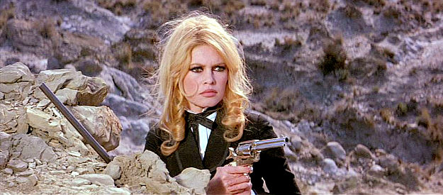 Brigitte Bardot as Irina Lazaar, ready to defend herself as the Apache draw closer in Shalako (1968)