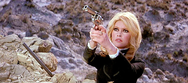Brigitte Bardot as Irina Lazaar, taking aim at an approaching Apache warrior in Shalako (1968)