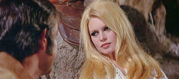 Brigitte Bardot as Irina Lazaar, wondering how Shalako got such an unusual name in Shalako (1968)