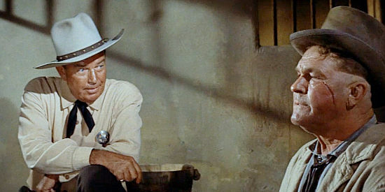 Bruce Cabot as Texas Ranger Maj. Henry helping interrogate gun-runner Ed McBain (Guinn 'Big Boy' Williams) in The Comancheros (1961)