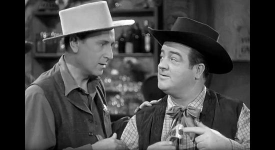 Bud Abbott as Duke Egan, proposing a plan for escaping Wagon Gap to Chester Wooley (Lou Costello) in the Wistful Widow of Wagon Gap (1947)
