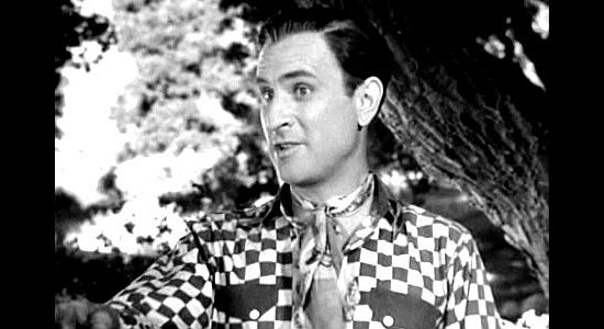 Bud Abbott as Duke, trying to convince Alabam' that his buddy punches cattle, just not in the literal sense, in Ride 'Em Cowboy (1942)