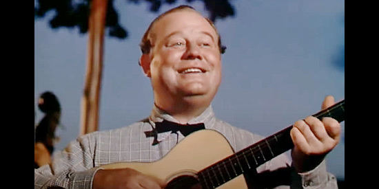 Burl Ives as Gus, a hand on the McLaughlin ranch, providing music at a town dance in Green Grass of Wyoming (1948)
