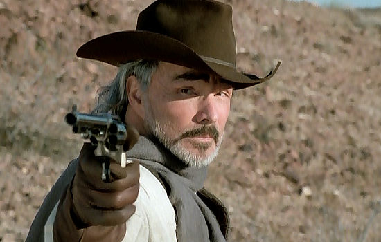 Burt Reynolds as John Chill McKay, freed from Yuma Prison to help track down a killer in Hard Ground (2003)