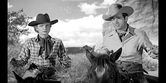Carole Mathews as Laura Jordan and Guy Madison as Larry Knight, running into a roadblock en route to starting a new life in Massacre River (1949)