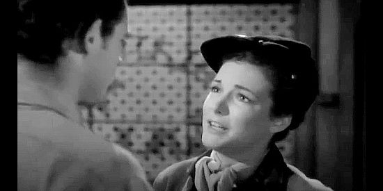 Cathy Downs as Kitty Reid, demanding answers from former fiancee Larry Knight in Massacre River (1949)