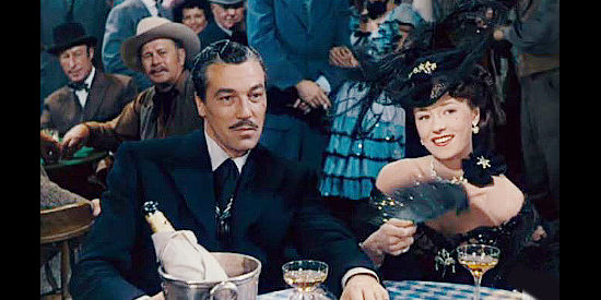 Cesar Romero as Blackie with Pati Behrs as Roulette, the gal who throws Freddie into a fit of jealousy in The Beautiful Blonde from Bashful Bend (1949)