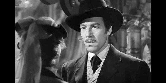 Cesar Romero as Doc Holliday, shocked by former love Sarah Allen's arrival in Tombstone in Frontier Marshal (1939)