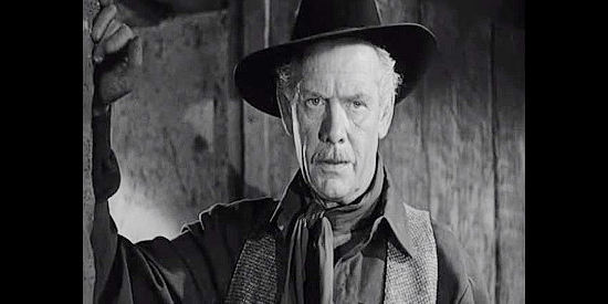 Charles Bickford as Pat Garrett, on the trail of an unusual bank robber in Four Faces West (1948)