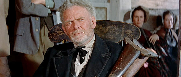 Charles Bickford as Zeb Rawlins, demanding to now the reasons behind a son's death in The Unforgiven (1960)