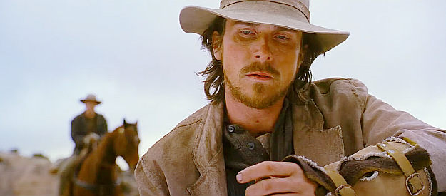 Christian Bale as Dan Evans, contemplating selling his wife's broach in 3:10 to Yuma (2007)