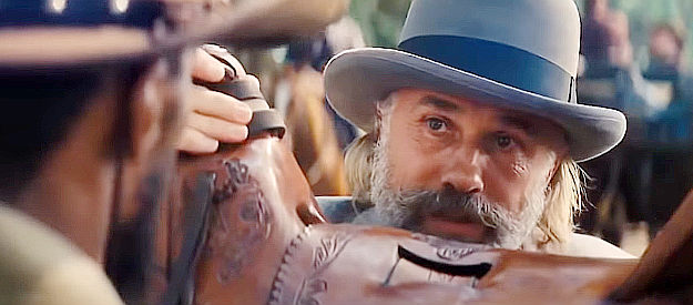 Christoph Waltz as Dr. King Schultz, talking strategy with Django in Django Unchained (2012)