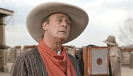 Christopher Cazenove as Lord Peter, a cattle king playing cowboy for the camera in Johnson County War (2004)