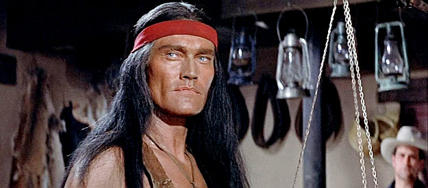 Chuck Connors as Geronimo, standing in line for rations in Geronimo (1962)