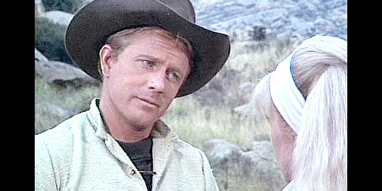 Chuck Courtney as Billy the Kid, wondering whether Betty's uncle will forgive his gunslinging past in Billy the Kid vs. Dracula (1965)